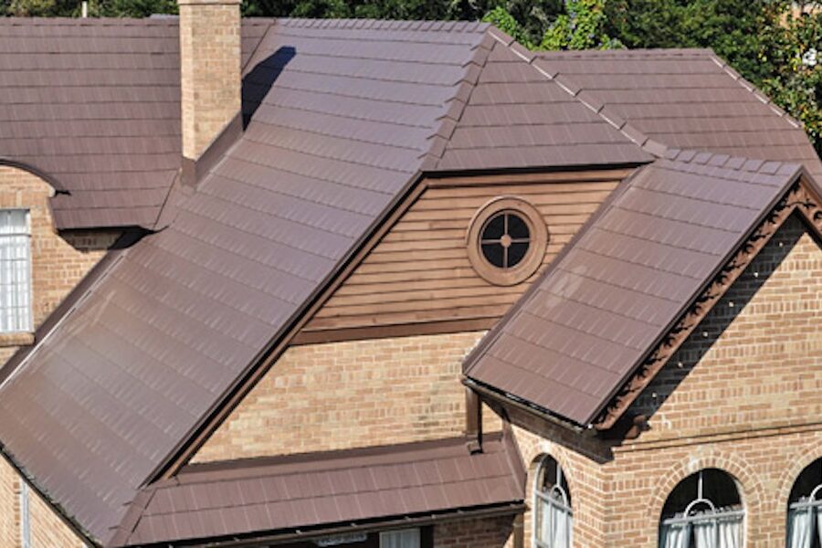 Beautiful Metal Brown Tile Metal Roofing on a brick house. 